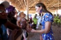 The Duchess of Cambridge meeting a child on her Caribbean tour with Prince William / Picture Credit: PA Images