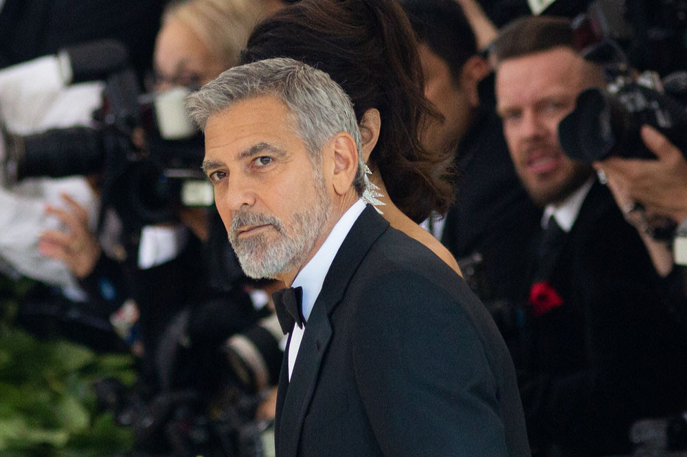George Clooney confesses that he cuts his hair himself
