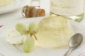 Gold leaf sparkling jellies with iced frozen red grapes and creme Chantilly