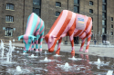 Candy-striped ice-cream cows enjoy the goings on at King's Cross ice-cream festival