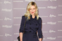 Kirsten Dunst wearing her trench as a dress