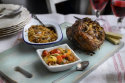 Roasted Leg of Lamb with a Shallot and Chorizo Stuffing served with a Spiced Shallot and Cherry Tomato Sauce