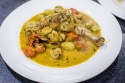 Vinegar and tarragon chicken fricassée with grapes, cherry tomatoes and button mushrooms