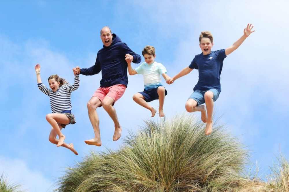 Catherine, Princess of Wales has posted a snap of Prince William leaping over sand dunes with their three children to mark his 42nd birthday