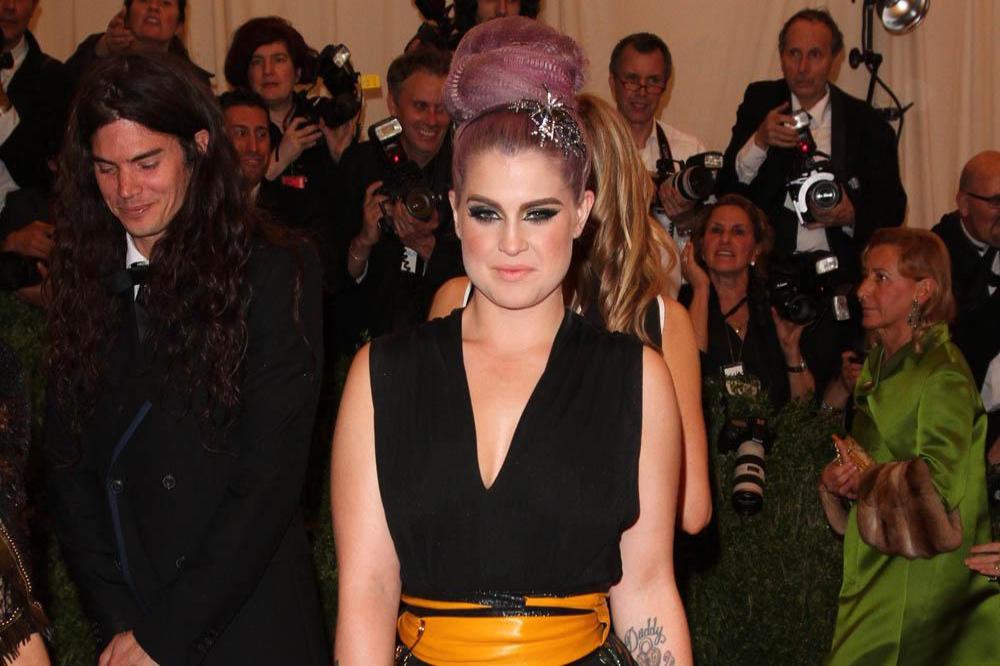 Kelly Osbourne poses with Do Something Award