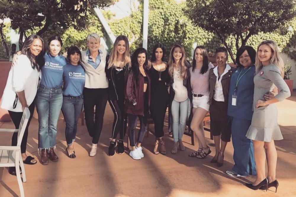 Kim, Khloe, and Kourtney Kardashian with the Planned Parenthood staff