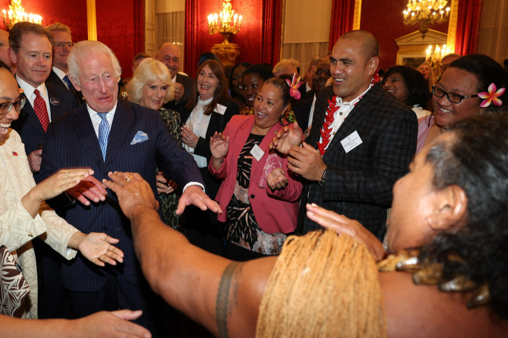 King Charles dances with Freddie Tuilagi