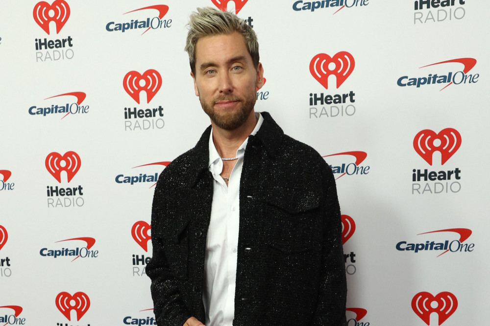 Lance Bass would love to reunite with NSYNC