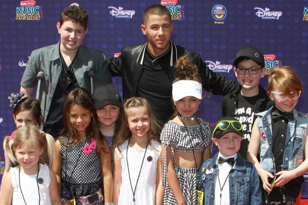 Nick Jonas and his guests at the Radio Disney Music Awards