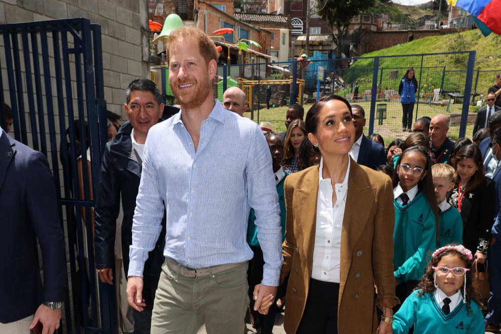 Prince Harry and Meghan, Duchess of Sussex are being protected on their Colombia tour by an officer armed wielding a Kevlar shield known as a “ballistic briefcase” to stop a gunman targeting the couple