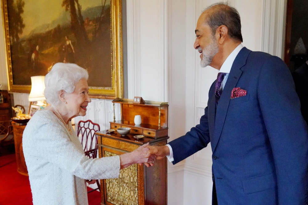 Queen Elizabeth smiled as she shook the Sultan of Oman's hand