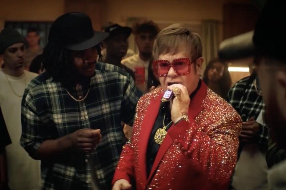 Sir Elton John in the new Snickers ad (c)