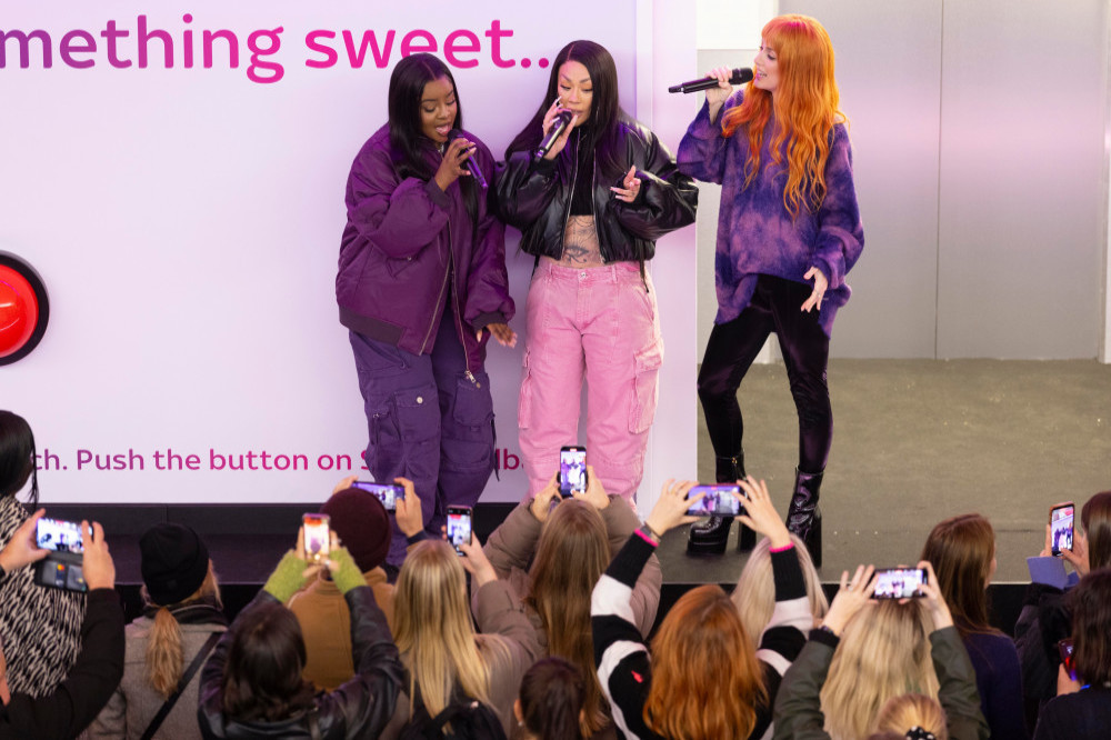 Sugababes performing at London King's Cross station