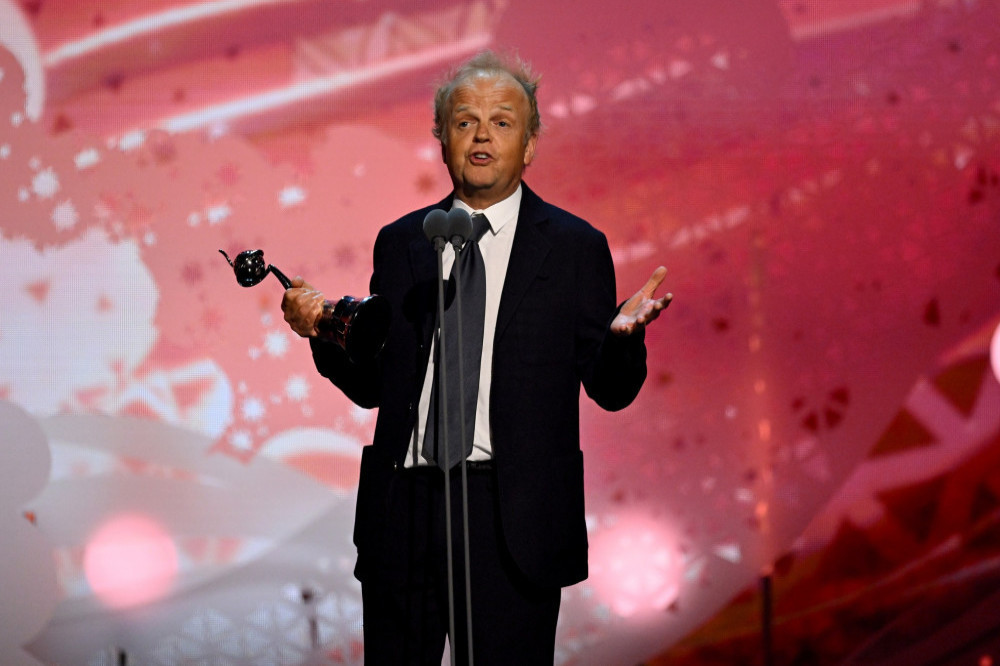 Toby Jones collects his prize at the NTAs