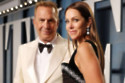 Kevin Costner and Christine Baumgartner have settled their divorce and the former model is said to be keen to move on with her life