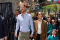 Prince Harry and Meghan, Duchess of Sussex are being protected on their Colombia tour by an officer armed wielding a Kevlar shield known as a “ballistic briefcase” to stop a gunman targeting the couple