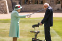 Queen Elizabeth II knighting Captain Sir Tom Moore