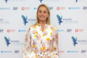 Tamzin Outhwaite has confirmed her split from Tom Child and insists she is 'happy' with single life