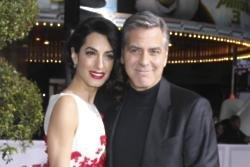 George and Amal Clooney donate $1m