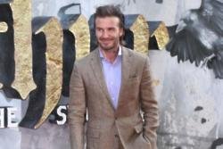 David Beckham dominates the red carpet at the King Arthur Premiere