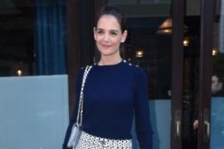 Katie Holmes prays to influence basketball games