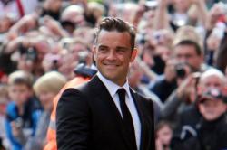 Robbie Williams Buffs Up To Promote Clothing Line