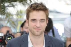 Robert Pattinson Trips On Red Carpet