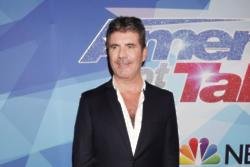 Simon Cowell gives relationship advice to his three-year-old son