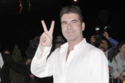 Simon Cowell has been ordered to stay away from his pregnant lover Lauren Silverman.