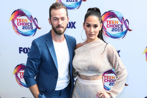 Artem Chigvintsev and Nikki Garcia have settled their divorce