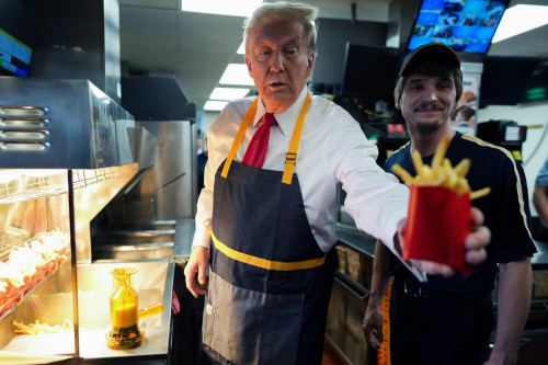 Donald Trump works at McDonald's to rile up fast-food chain's former employee Kamala Harris