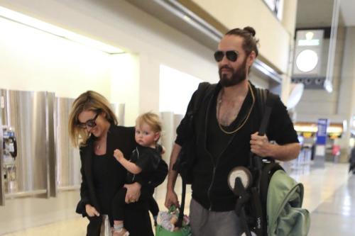 Russell Brand and Laura Gallacher look cosy on family trip with Mabel