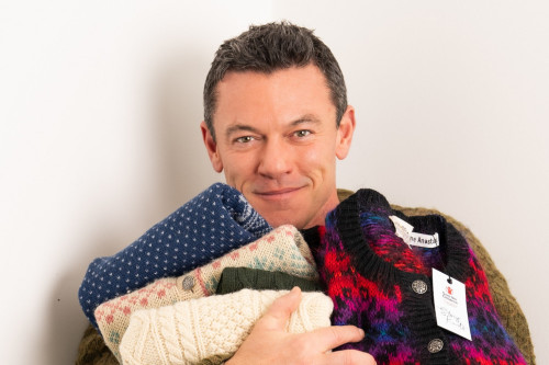 Luke Evans is 'in a festive mood' with Christmas knitwear