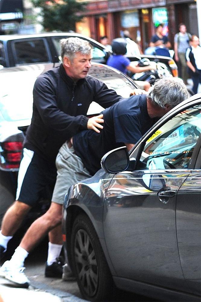 Alec Baldwin grabbing a photographer in New York City