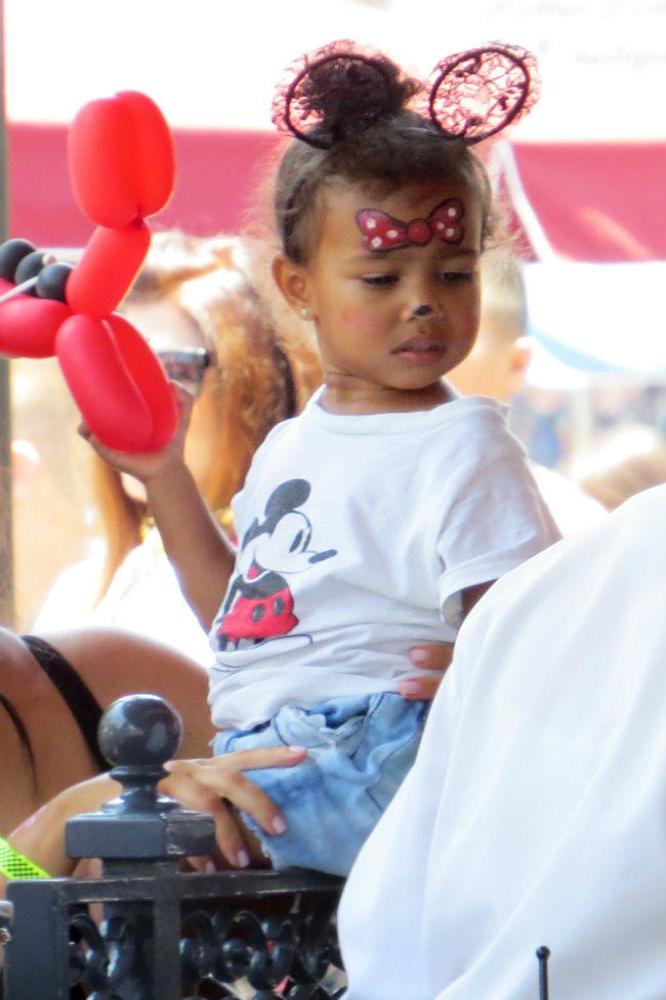 Kim Kardashian West with North West at Dsneyland