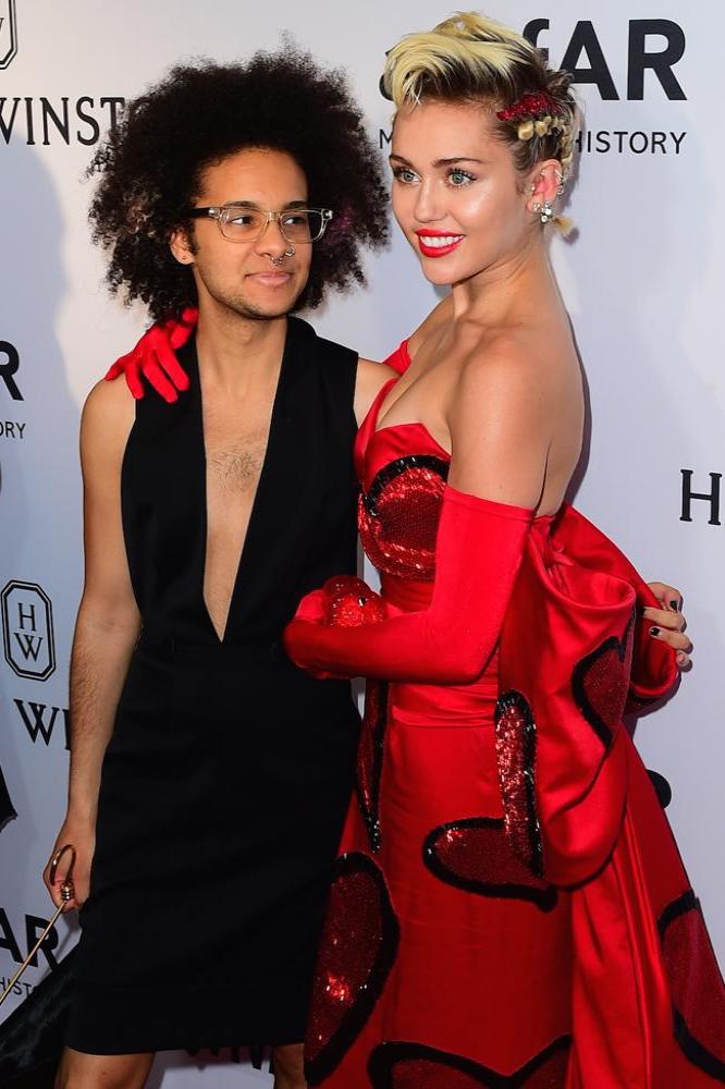 Tyler Ford and Miley Cyrus at the amfAR Inspiration Gala