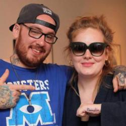 Adele showing off tattoo with Bang Bang 