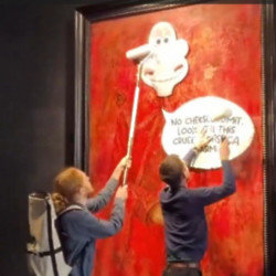 Animal Rising activists have defaced the new portrait of King Charles