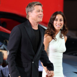 Brad Pitt is said to have been ‘very affectionate and cheerful’ with girlfriend Ines De Ramon as he made their relationship ‘red carpet official’