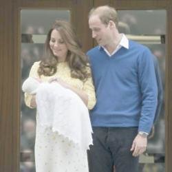 Prince William with Duchess Catherine and Princess Charlotte