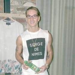 Proudlock at his Serge DeNimes Spring/Summer 15 collection launch holding a bottle of AquaVita