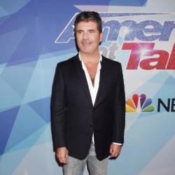 Simon Cowell asks dead parents for advice