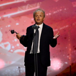 Toby Jones collects his prize at the NTAs