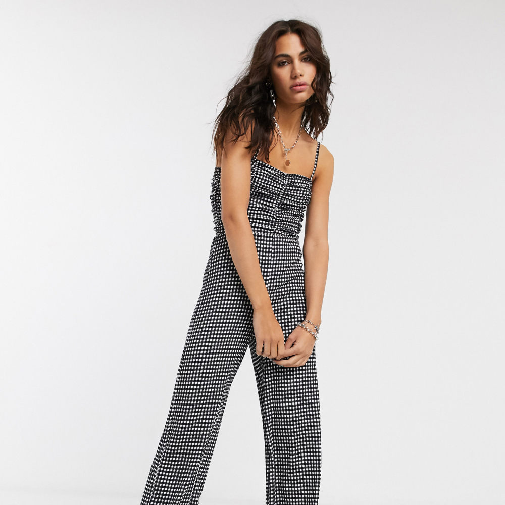 Bershka Ruched Front Strappy Gingham Jumpsuit in Monochrome, GBP 17.99; ASOS DESIGN Attitude 2 Lace Up Chunky Boots in Black, GBP 30, ASOS