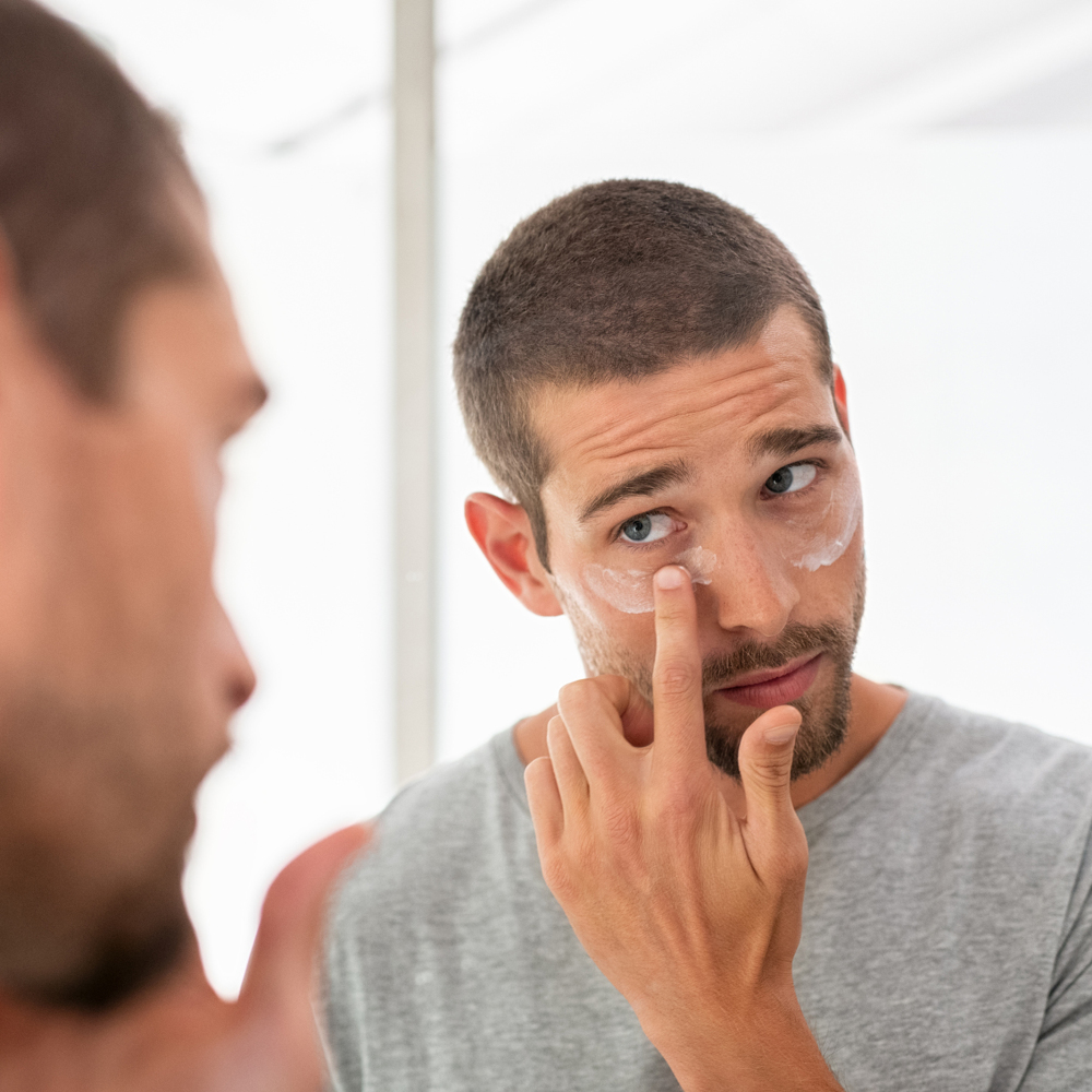 Man applying sunscreen