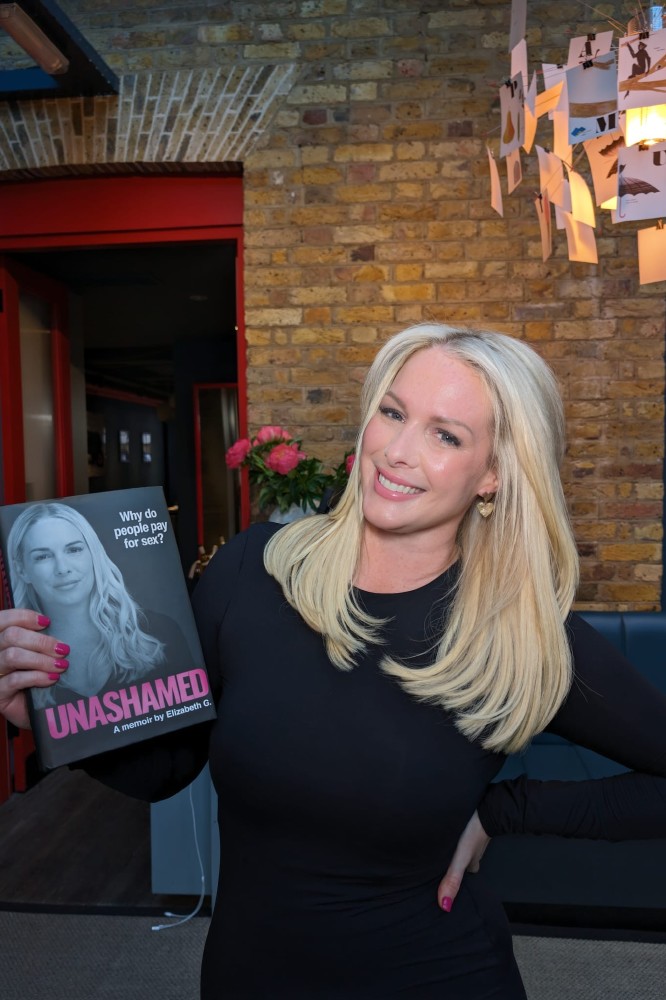 Elizabeth G pictured with her memoir 'Unashamed'