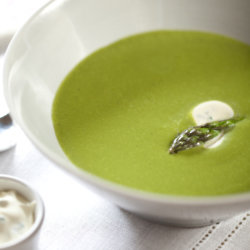 Asparagus and spinach soup topped with chive coconut cream