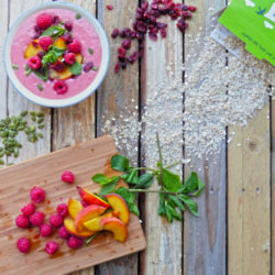 Oaty peach and raspberry smoothie bowl