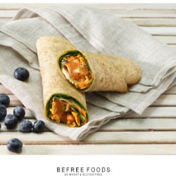 Sweet Potato Wrap with grated carrot, roasted sweet potato, red pepper, hummus and spinach